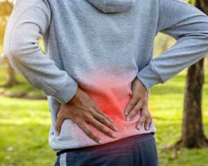 man messaging lower back pain